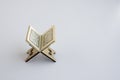 Miniature small wooden lectern with mini Holy Book on the white background Royalty Free Stock Photo