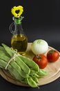 Preparation cook of fresh string beans with tomato,onion and olive oil.Mediterranean cuisine,