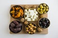 Top View Of Ramadan Iftar Foods:Various Olives,Dry Date Fruits,Cheese and Cherry Tomato with Walnuts