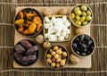 Top View Of Ramadan Iftar Foods:Various Olives,Dry Date Fruits,Cheese and Cherry Tomato with Walnuts