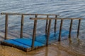 Rusty iron, a small pier placed by the blue sea Royalty Free Stock Photo