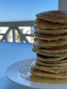Close up of tall pancake stack with honey drips Royalty Free Stock Photo