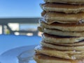 Close up of tall pancake stack with honey drips Royalty Free Stock Photo