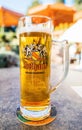 Close-up of tall Rothaus Hochschwarzwald beer pint with terrace defocused Royalty Free Stock Photo