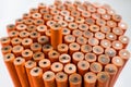 Close up on the tallest unsharpened orange pencil, on w Royalty Free Stock Photo