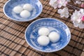 Close up of tangyuan yuanxiao in a bowl on gray table, food for Winter Solstice