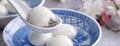 Close up of tangyuan yuanxiao in a bowl on gray table, food for Winter Solstice