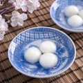 Close up of tangyuan yuanxiao in a bowl on gray table, food for Winter Solstice