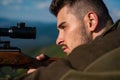 Close-up Target with optic sight. Snipers carbine at the outdoor hunting - close up portrait. Hunter with his rifle