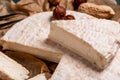 Close up Tasty cheese with nuts on linen napkin wooden background copy space cheese knives. National Italian French Camembert or Royalty Free Stock Photo
