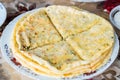 Close up pile of Caucasian khychin bread pie with stuffing