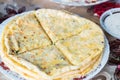 Close up pile of Caucasian khychin bread pie with stuffing