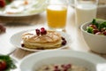 Close up of tasty pancakes served with syrup and berries Royalty Free Stock Photo