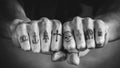 Close up of tattoos on fingers and knuckles