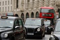 Close up of taxi and red double decker bus in traffic on Regent Street London Royalty Free Stock Photo