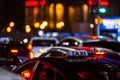 Close-up of a taxi in a traffic jam in the center of big city at night Royalty Free Stock Photo