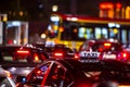 Close-up of a taxi in a traffic jam in the center of big city at night Royalty Free Stock Photo