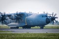 Close-up taxiing of heavy military transport turboprop aircraft Royalty Free Stock Photo