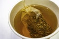 Tea bag with hot water in paper hot drink cup Royalty Free Stock Photo