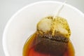 tea bag in paper cup and hot water Royalty Free Stock Photo