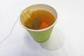 Close up tea bag in paper cup Royalty Free Stock Photo