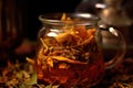 close-up of tea leaves steeping in a glass teapot