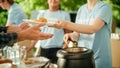 Close Up of a Team of Volunteers Helping in a Local Community Food Bank, Handing Out Free Food to