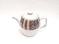 Close up teapot with batik patern motif on isolated white background Royalty Free Stock Photo