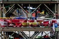 Close up tear colorful Tibetan prayer flags waving and swaddled with bridge over frozen river at Thangu and Chopta valley. Royalty Free Stock Photo