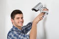 Technician Adjusting CCTV Camera Royalty Free Stock Photo