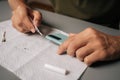 Close-up of technician cleaning smartphone using specialized tools sitting at table, ensuring optimal quality and device Royalty Free Stock Photo