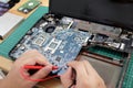 Close up of technician engineer trying to repairing broken laptop. Computer repairs and upgrade Royalty Free Stock Photo