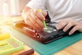 Close up of technician engineer trying to repairing broken laptop. Computer repairs and upgrade Royalty Free Stock Photo