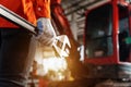 Close up of A technician hand holding a tool for maintenance or machine service in the workshop. Heavy Duty Equipment Maintenance Royalty Free Stock Photo