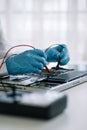 Close up of Technician measuring voltage electronic circuit board, Service after sale fix electric equipment