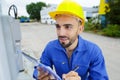 close-up technician reading outdoor meter Royalty Free Stock Photo