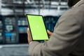 Close up of technician using isolated screen tablet in data center Royalty Free Stock Photo