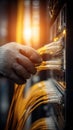 Technician& x27;s gloved hand connects yellow ethernet cables to a server rack Royalty Free Stock Photo
