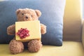 Close Ã¢â¬â up teddy bear. Teddy bear and yellow gift box with Pillow. Royalty Free Stock Photo