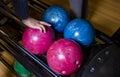 Close-up on teen children hand holding bowling ball against bowling alley - Image. Cheerful Kids are ready to play - Image. The Royalty Free Stock Photo