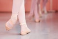 Close-up of teenage ballerina`s feet, practicing ballet moves in a dancing studio Royalty Free Stock Photo