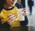 Close up of teenage girl eating hamburger obesity concept Royalty Free Stock Photo