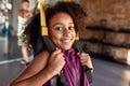 Close up of teenage girl having fun while training using fitness straps in gym. Sport, healthy lifestyle, physical Royalty Free Stock Photo