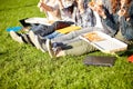 Close up of teenage students eating pizza on grass Royalty Free Stock Photo