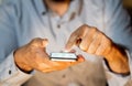 Close up of young man hands using smartphone in Phone Addiction and Mobile Gaming concept Royalty Free Stock Photo