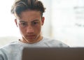 Close up of teenager or young man working in his laptop or watching videos -  boy at home playing videogames Royalty Free Stock Photo