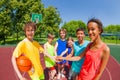 Close-up of teens with arms in star shape