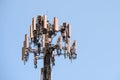 Close up of telecommunications cell phone tower with wireless communication antennas; blue sky background and copy space on the Royalty Free Stock Photo