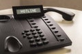 Close up on telephone device at office desk. Royalty Free Stock Photo