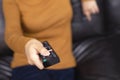 Close up Television remote control in casual woman Royalty Free Stock Photo